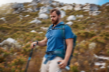 Image showing Blur motion, hiking and man on outdoor for health, wellness and on mountain range with stick for balance. Nature, healthy male and hiker enjoy walking, exercise and natural space for adventure.