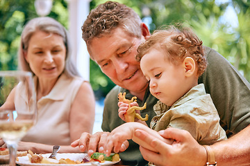 Image showing Food, grandpa and baby on lap eating vegetables for healthy, diet and nutrition in family home. Help, health and elderly grandparents teaching child grip for child development and wellness.