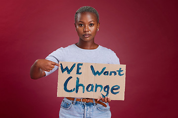 Image showing Black woman, cardboard sign and protest for change, end racism and equality for people on studio background. Young girl, point to poster and human rights to fight against discrimination and gesture.