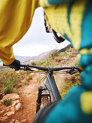 Image showing Mountain biker, dirt track and cycling sport for fitness, exercise or training workout in the nature outdoors. Active sports cyclist riding on extreme rocky trail, terrain or land in the countryside