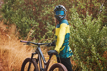 Image showing Mountain bike man with cycling helmet taking a break from adventure, action sports and freedom on off road, nature and dirt path. Bicycle athlete stop outdoors after training, workout and biker race