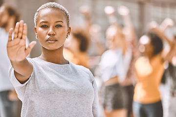 Image showing Black woman protest, stop hand sign on street or human rights equality, activism group for freedom in city. Portrait of woman against gender violence abuse, for change future of women or black people