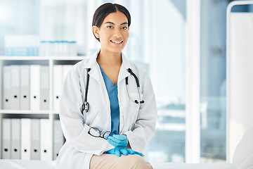 Image showing Healthcare, medicine and a happy doctor, woman in her office with a smile and a stethoscope. Vision, success and empowerment, portrait of a female medical professional or health care employee at work