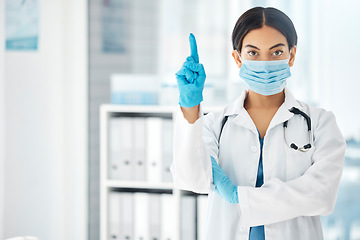 Image showing Woman, pointing doctor and covid face mask in hospital, clinic or wellness pharmacy for global virus stop, compliance or rules. Portrait, healthcare worker or medical employee with advertising space