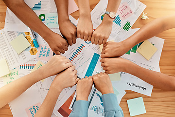 Image showing Fist bump, team and business people, support and solidarity in meeting above planning and strategy paperwork. Diversity, hands and collaboration with trust and community, teamwork and partnership.