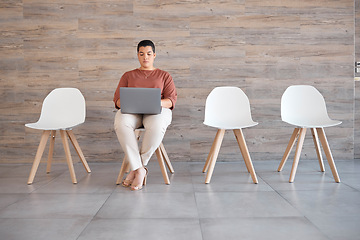 Image showing Interview, laptop and woman waiting for a recruitment meeting alone in the modern office. Hiring, technology and professional lady from Canada doing cv update on computer while sitting in a workplace