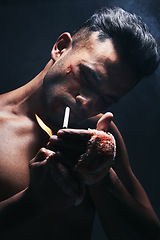 Image showing Boxer, man and cigarette smoking after fight, blood and bandage from injury against a black studio background. Fighter smoke after boxing, training or mma match with bruise, violence and blood scar