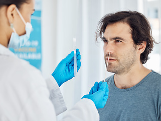 Image showing Covid test, patient and nose swab of a doctor pcr test a man for corona in a hospital or clinic. Healthcare, medical and health consultant working to help with coronavirus consulting and nursing