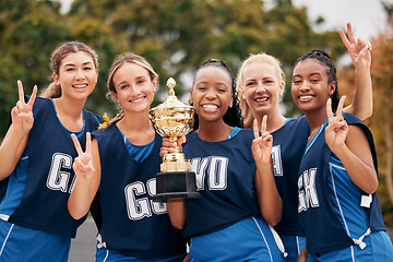 Image showing Sports, netball and trophy with a woman team in celebration as a winner group of a victory or achievement. Peace, winning and teamwork with a female sport group celebrating success with a cup