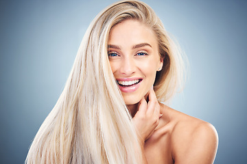 Image showing Hair care, skincare and portrait of a woman with beauty, wellness and luxury dermatology against a blue studio background. Spa, health and happy girl model with facial cosmetology and smile for skin