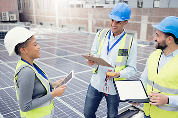 Image showing Teamwork, planning and employees in solar panel industry for installation, renewable energy and engineering with a tablet. Meeting, construction and engineers talking about solar energy on a roof