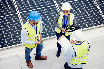 Image showing Top view, engineer teamwork and planning of solar panel maintenance, inspection or installation. Solar energy, renewable energy and group of contractors with tablet, tech or checklist in discussion.
