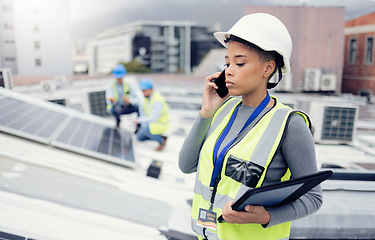 Image showing Engineer woman talking with phone, solar energy on roof and sustainable renewable energy in construction. Building manager, working with eco friendly solar panel or electricity maintenance project