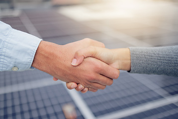 Image showing Handshake, welcome and b2b with a business man and woman shaking hands at a solar power plant. Meeting, thank you and collaboration with an employee team in agreement in the energy supply industry