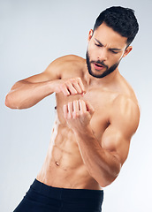 Image showing Body, fight and muscle with a man model in studio on a gray background for fitness or exercise. Sports, workout and training with a young male fighter posing topless for training or martial arts