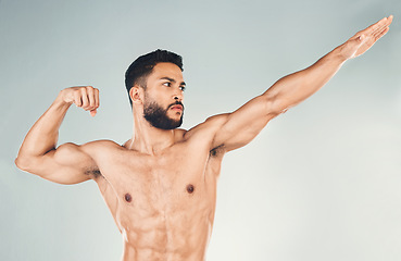 Image showing Fitness, strong and sports man ready to fight, exercise and workout for health, wellness and power with his fist up. Bodybuilder or athlete fighter model training for sport, inspiration and goal