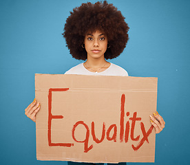 Image showing Equality, protest banner and black woman in studio holding sign for empowerment, change and feminism. Equal rights, poster and female protesting for human rights, racial discrimination and freedom.