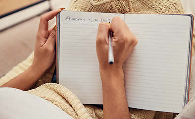 Image showing Hands of woman relax, writing in notebook mockup for morning routine on living room sofa. Affirmations, personal goals and book of calm life thoughts or young girl creative thinking journal on couch