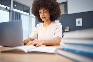 Image showing Laptop, black woman and notebook in office with business woman research creative idea at a desk, inspired and motivated. Corporate, innovation and girl with a vision typing, planning and reading