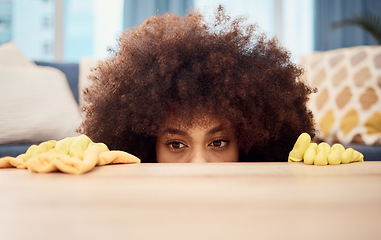 Image showing Cleaning, living room table and black woman with clean rubber gloves inspection and check for dust. Morning house chores, maid and cleaner working in a home lounge looking and searching for dirt