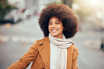 Image showing Winter, fashion and black woman in the city street for holiday, travel and happiness in Portugal. Smile, thinking and young African girl happy on a vacation in the road with fall clothes and an afro