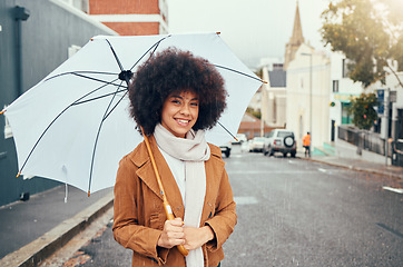 Image showing Woman, fashion and umbrella portrait in winter city while travelling and sightseeing. Tourist, style and happy young female student commuting in an urban town in cold weather during autumn