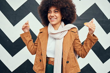 Image showing Black woman afro, smile and trendy fashion on urban background and happy haircare or creative beauty. Woman, happiness and curly african hair, art wall city or metro hand sign in New York for style