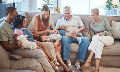 Image showing Big family, happiness and love on house sofa with children, parents and grandparents together for bonding, quality time and relax. Happy kids, women and men in interracial family home in Europe