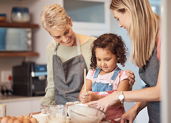 Image showing Grandma, mother and child baking in kitchen together while girl learns to mix cake mixture, pancake batter or muffin mix. Family cooking dessert, kid learning and cooking snack food for home dinner