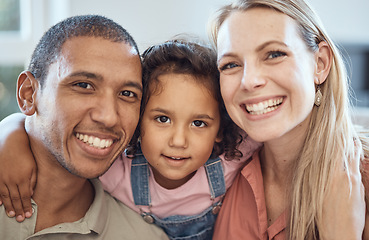 Image showing Happy, smile and interracial parents with their child sitting, bonding and relaxing together. Portrait of a mother, father and girl kid with happiness, love and care on a sofa in their family home.