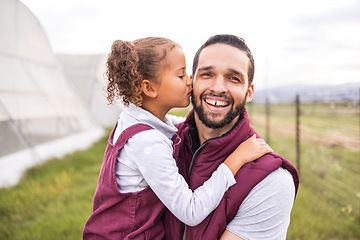 Image showing Farm, father and child kiss dad cheek for bonding and affection on sustainable farming land. Parent, dad and daughter being affectionate with love and care on agriculture and organic green field