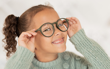 Image showing Face portrait, child and girl with glasses for optical health at optometrist office. Eyes wellness, eye care and happy kid with specs, spectacles or prescription lenses to help with ocular vision.