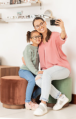 Image showing Glasses, retail and selfie with mother and child in vision and optometry store for eyewear. Shopping, photo and parent taking picture in eyewear shop for eye care, eye health ophthalmology