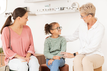Image showing Optometry, glasses and vision with a girl, mother and optician meeting for an appointment or checkup in an optometrist office. Family, kids and eyewear with a woman and daughter at an ophthalmologist