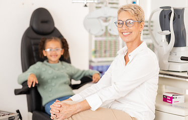 Image showing Ophthalmologist, child patient and vision test or eye exam for eye care to check and examine eyesight at a clinic or optometry store. Portrait of woman doctor or specialist ready for optics care