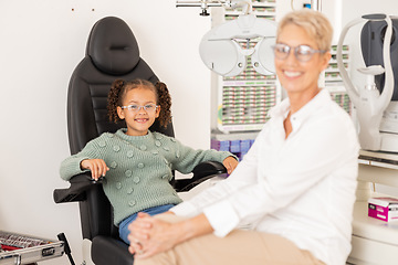 Image showing Children, vision and glasses with a girl customer and optometrist consulting in an office for an eye test. Portrait, eyewear and retail with a female child and optician consulting in an appointment