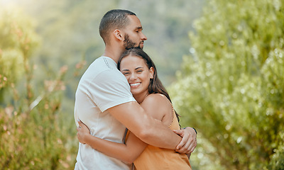 Image showing Love, hug and couple on a date in nature, happy and at peace together during summer. Relax, smile and young man and woman hugging with affection and bonding in a park or garden on a holiday