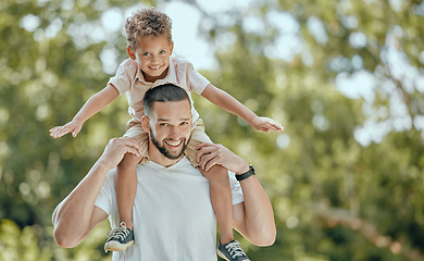 Image showing Family, happiness and nature park with dad carrying child on shoulders for fun, adventure and quality time together in summer. Portrait of man and boy outdoor to relax, smile and happy about freedom
