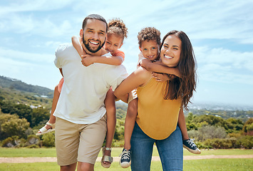 Image showing Happy mom, dad and children on piggyback ride from parents in nature park for fun, summer time bonding and outdoor family activity. Black father, mother and kids smile together while playing on grass