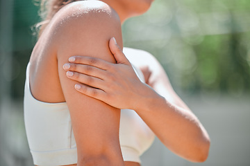 Image showing Sport injury, arm pain and woman athlete hand holding a muscle after a sports accident or strain outdoor. Bruise, medical emergency of injured arms after a exercise workout, training or fitness