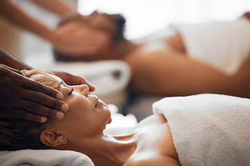 Image showing Head massage, spa bed couple and relax on vacation, holiday or retreat with happiness, peace or zen. Black woman, physical therapy salon and lying for care, health or wellness with black man for rest