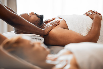 Image showing Black man, spa and couple massage for relax, skincare and wellness at resort on anniversary weekend. Reflexology therapist touch body muscle of sleeping guy on salon bed, stress relief and zen detox