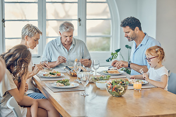 Image showing Family, food and children with grandparents, parents and grandkids around a dining room table together for lunch. Love, dinner and eating with a senior man and woman enjoying a meal with relatives