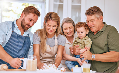 Image showing Grandparents, parents and kid baking, happy and being loving together in kitchen. Family, cooking and smile with happiness, spend quality time and have fun while bonding, make food and meal at home.