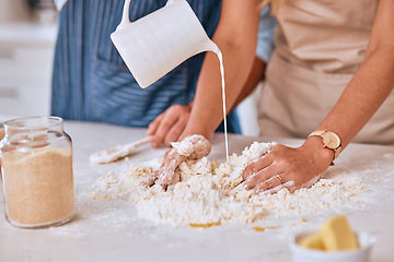 Image showing Couple bake together, hands with dough in kitchen, for bonding and learning to be baker and baking skill together. Man, woman with flour and butter for pastry or bread, with cooking for love and fun.