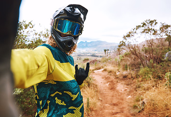 Image showing Sports, biker selfie and cycling in nature, countryside or outdoors. Bmx, rock hand sign or self portrait of cyclist on sand or dirt road for adventure, memory or online picture post on social media