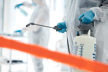 Image showing Covid disinfection, red tape and man in hazmat suit to safety protect from corona virus while cleaning hospital clinic. Contaminated science laboratory, medical ppe or healthcare worker sanitize room