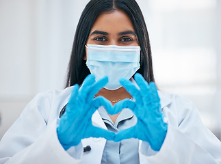 Image showing Covid, doctor and hands heart sign from medical worker for covid 19 help, corona virus support and healthcare wellness. Face mask, science laboratory and portrait of medicine scientist in hospital