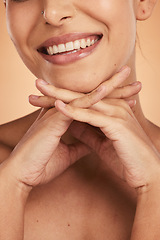 Image showing Dental teeth, face and beauty of woman on orange studio background. Oral health, wellness and closeup of female model with smile, natural looking veneers and healthy tooth hygiene or dental care.