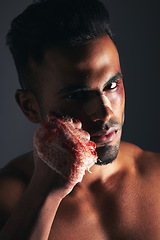 Image showing Violence, man and portrait with blood fist of angry fighter with bruise, injury and wound plaster. Boxer, fitness and anger aggression of mma person with intense dark studio shadow background.